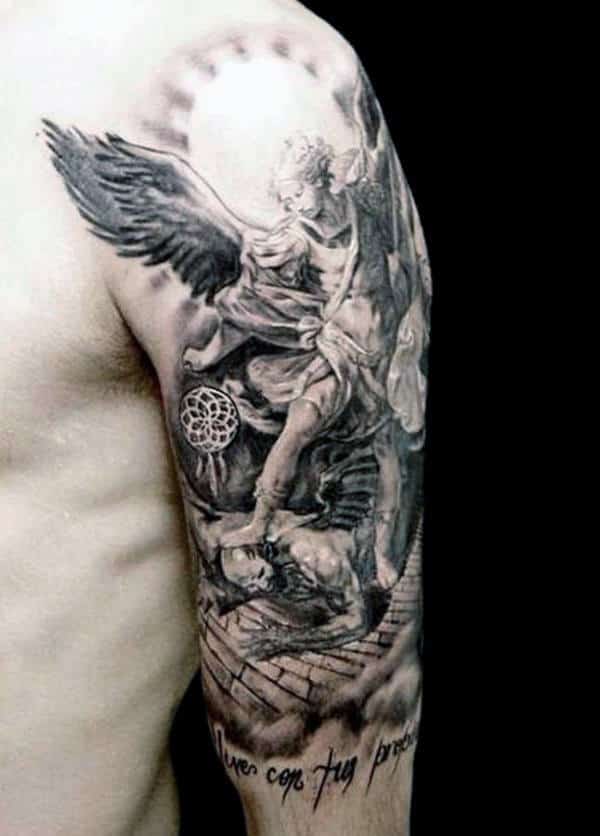 Tattoo of an angel battling a demon on an upper arm