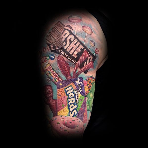 Vibrant candy-themed sleeve tattoo featuring Hershey's, Nerds, Smarties, and lollipops, creating a colorful and detailed sweet-inspired design.