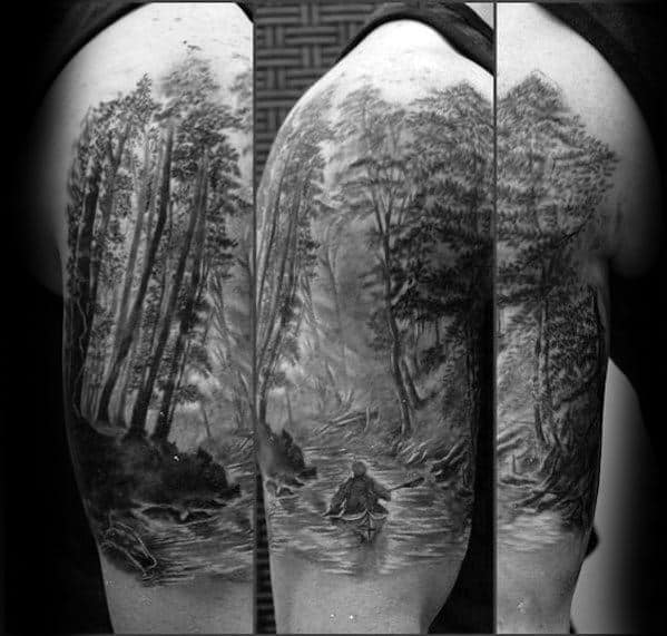 Alt text: Highly detailed black and grey tattoo of a canoeist paddling through a forested river, with a realistic and atmospheric landscape.