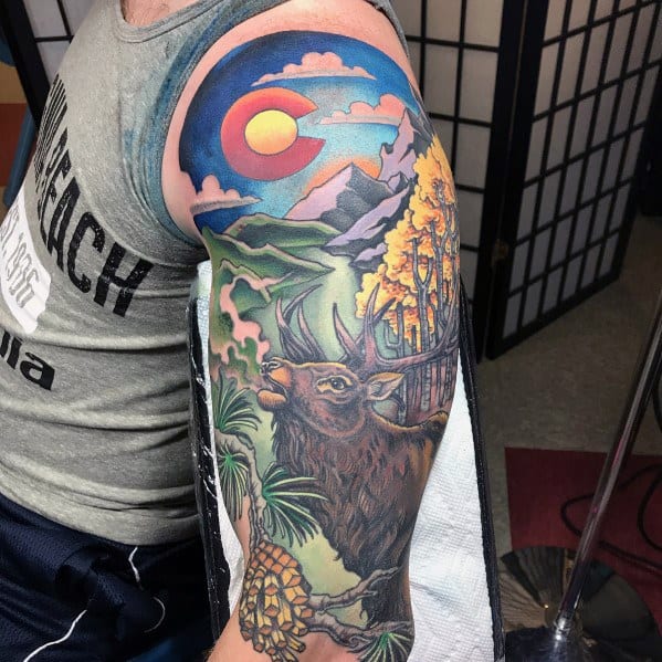 Vibrant Colorado-themed elk tattoo sleeve, featuring bold colors, mountain scenery, aspen trees, and the state flag for a striking nature design.