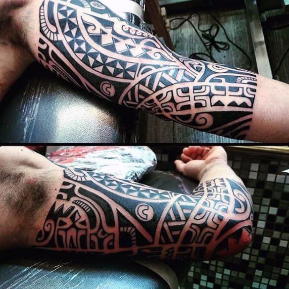 Half Sleeve Maori Tattoos For Guys With Black Ink