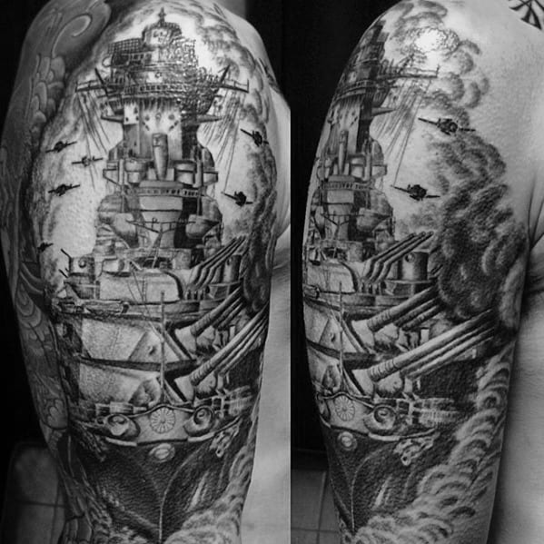 Detailed battleship tattoo covering upper arm, featuring cannons, smoke, and fighter planes