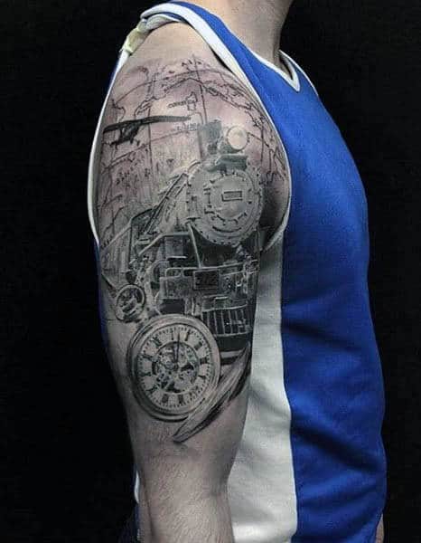 Person with a detailed train and clock tattoo on their upper arm, wearing a blue and white tank top, with an airplane design subtly incorporated into the artwork