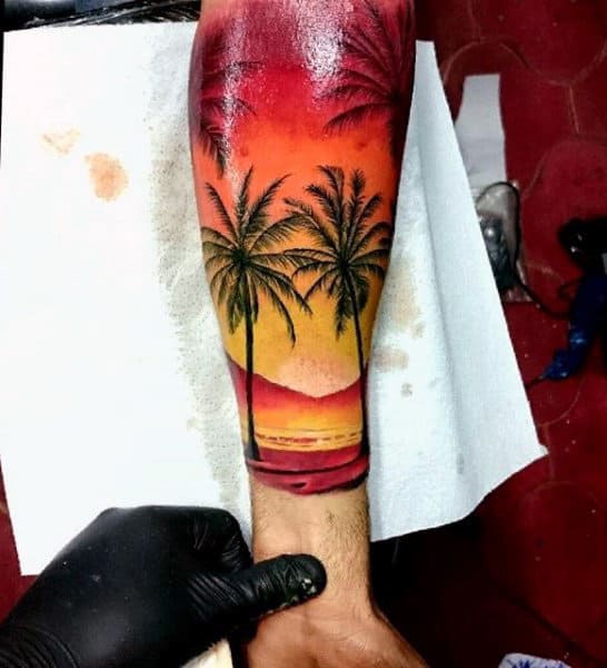 Half Sleeve Sunset And Palm Beach Tattoo With Dramatic Color On Gentleman