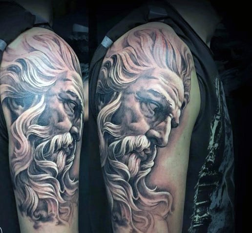 Detailed tattoo of a bearded man on a person's upper arm