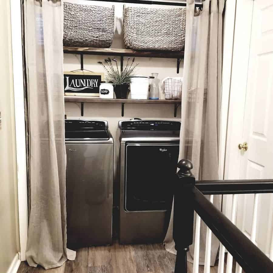 rustic laundry hidden by gray curtains 