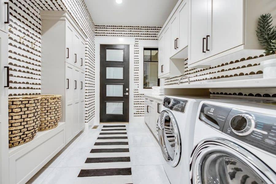 narrow galley laundry white cabinets dryer and washer 
