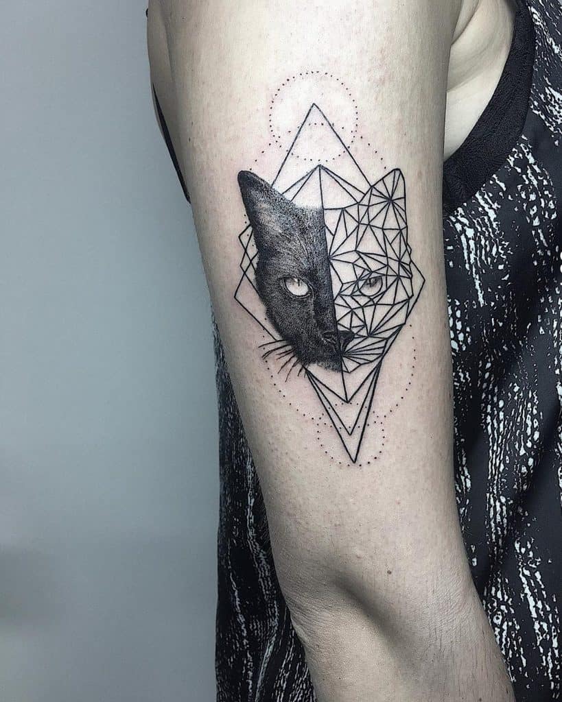 Upper arm tattoo of a black cat, half realistic and half geometric, framed by fine line shapes for a bold and modern artistic contrast.