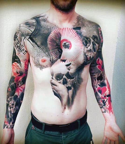 Man with extensive colorful tattoos covering his upper torso and arms