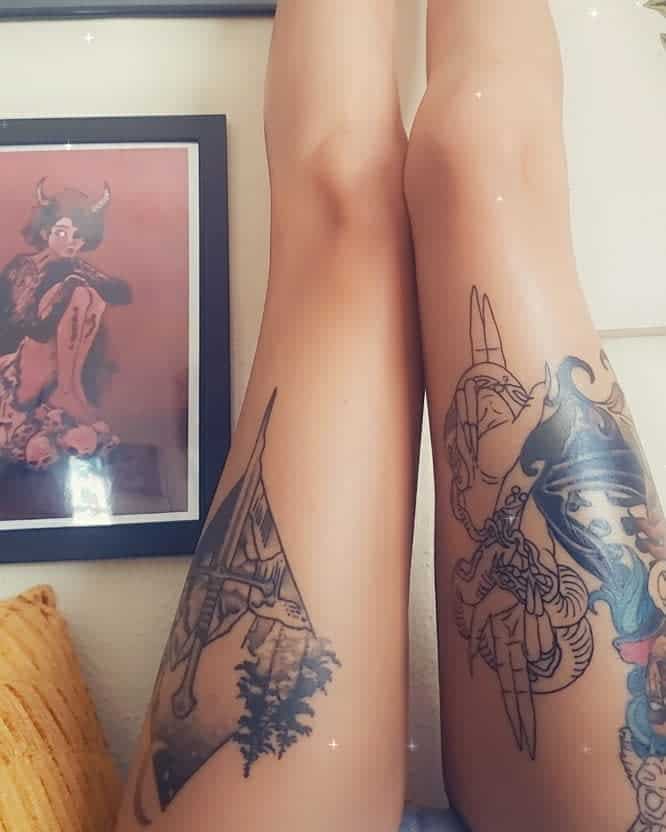 Leg tattoos featuring intricate designs, including nature-inspired linework and mythological elements, expressing personal symbolism and storytelling