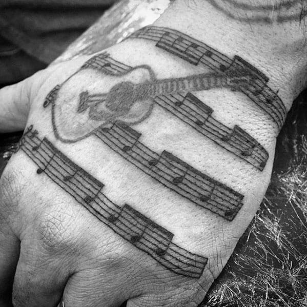 Hand Guitar With Music Staff Tattoo Ideas On Guys
