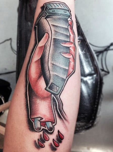Hand Holding Clipper Barber Tattoo With Bones For Men