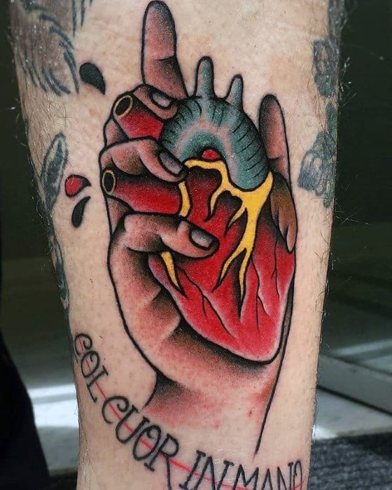 Hand Holding Heart Traditional Mens Tattoo Ideas