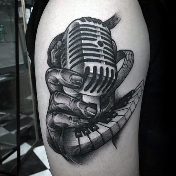 Hand Holding Microphone With Piano Keys Mens Arm Tattoos