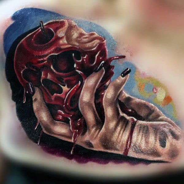 Hand Holding Water Skull Apple Mens Chest Tattoos