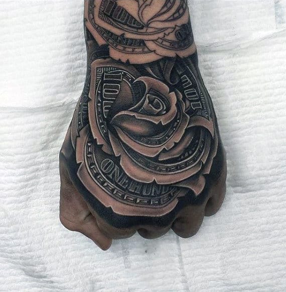 A detailed tattoo of a rose intertwined with dollar bills on a hand