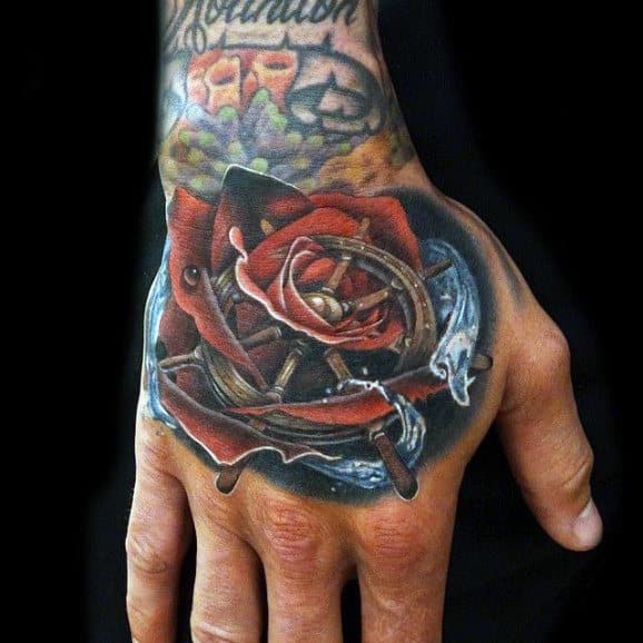 Hand Rose Flower Ship Wheel Tattoo On Male