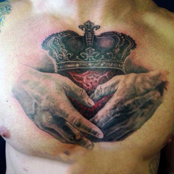 Handings Holding Heart With Crown Claddagh Mens Chest Tattoo