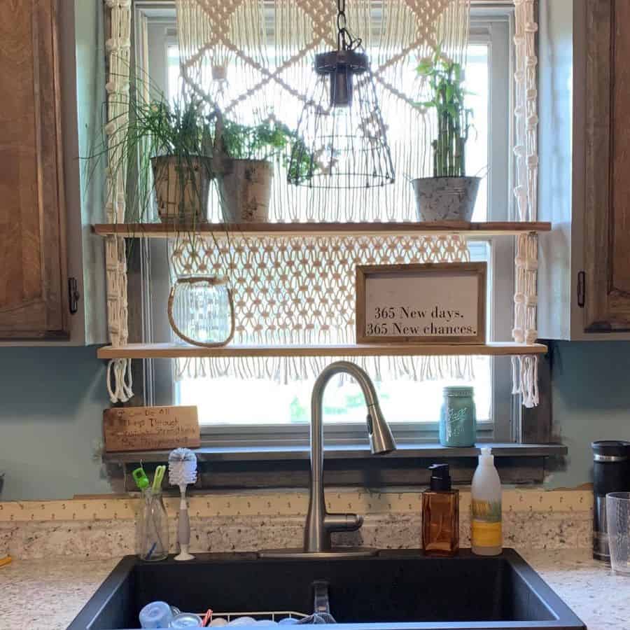 floating shelving over kitchen sink with pot plants