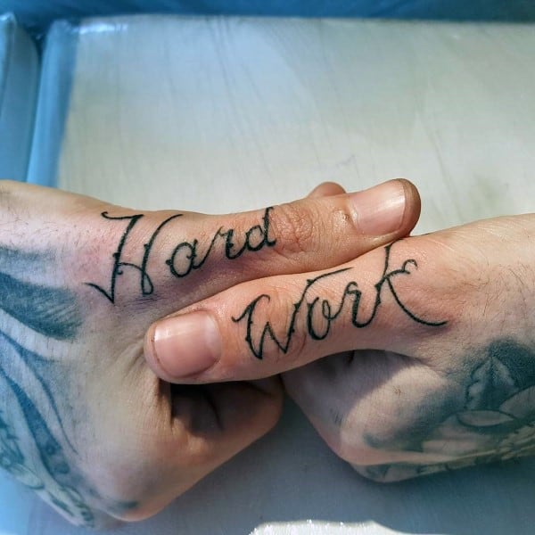 Hard Work Thumb Script Tattoos For Men