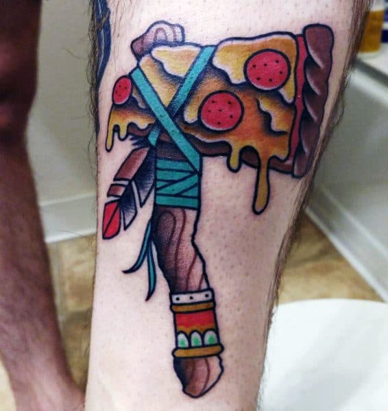 Colorful and playful hatchet tattoo featuring a pizza slice as the blade, with dripping cheese, pepperoni, tribal-inspired handle details, and feathers.