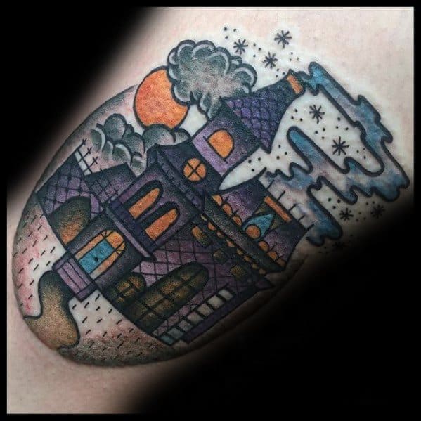 Colorful haunted house tattoo with a cartoonish style, featuring purple tones, orange moon, swirling smoke, and glowing windows.