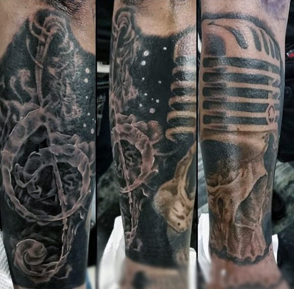 Haunting Dark Musical Skull Tattoo For Men On Legs