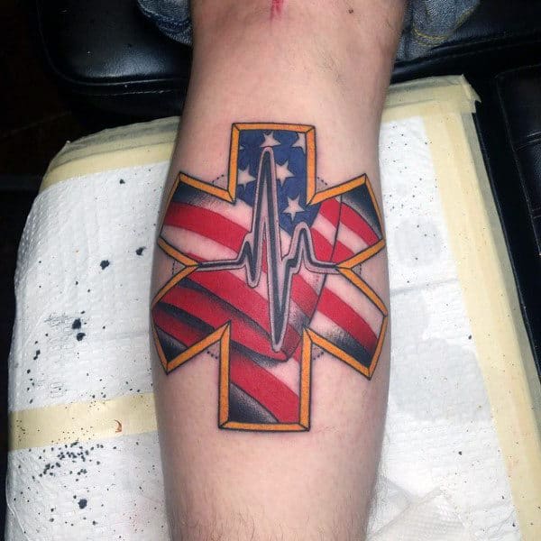 Star of Life tattoo featuring an American flag design and an EKG heartbeat line
