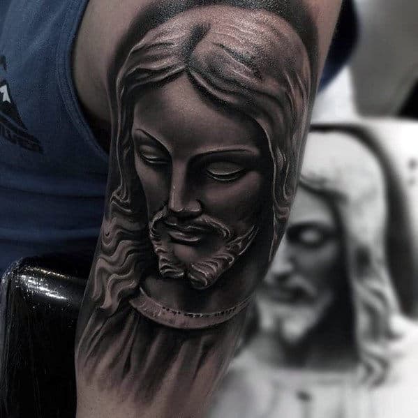 Heavily Shaded Catholic Guys Jesus Portrait Tattoo On Arm