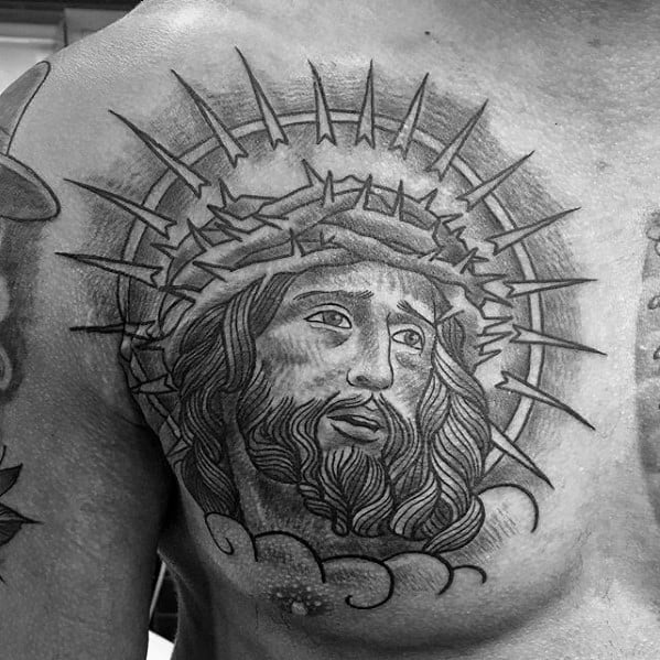 Heavily Shaded Male Jesus Portrait Tattoo On Upper Chest