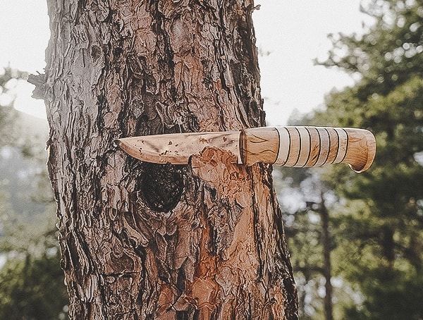 Helle Utvaer Knife Removing Tree Bark Outdoors