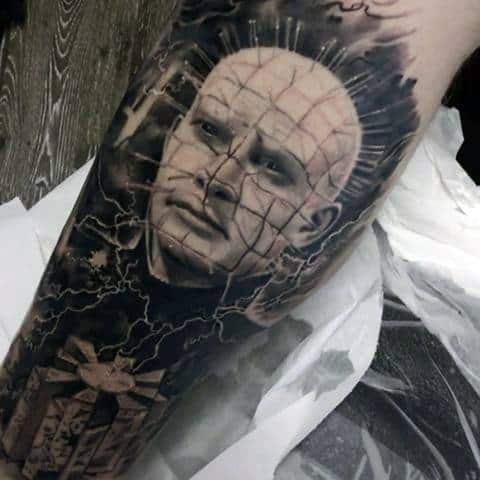 Black and grey *Hellraiser* tattoo of Pinhead with intricate shading, lightning effects, and the Lament Configuration for a dark, ominous design.