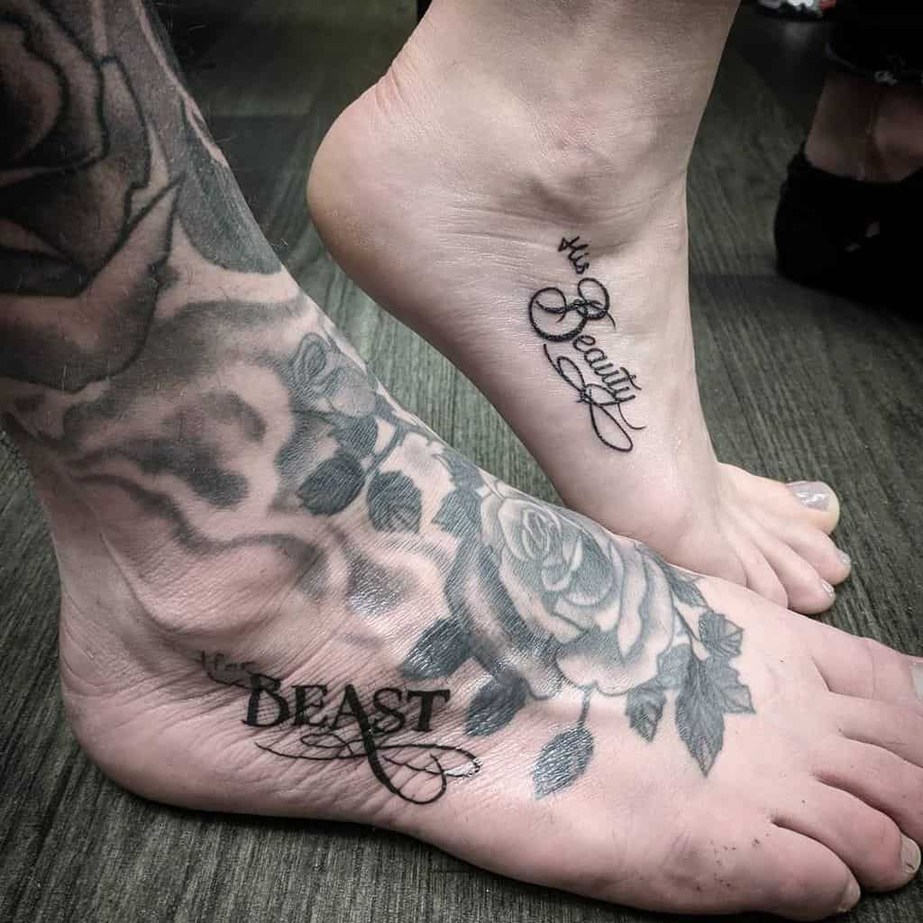Matching 'Her Beauty' and 'His Beast' foot tattoos in elegant script, with the Beast tattoo surrounded by detailed floral designs.