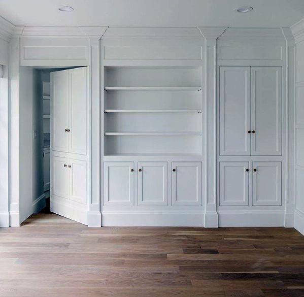 ornate white hidden door living space vinyl wood flooring