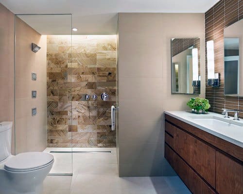 Contemporary bathroom featuring a walk-in shower with hidden ceiling LED lighting and elegant stone tiles for a sleek look