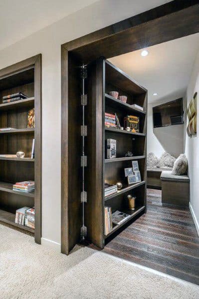 hinged dark stained wood bookcase hidden door