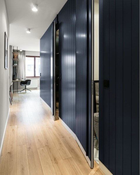 black hidden sliding door walls in hallway