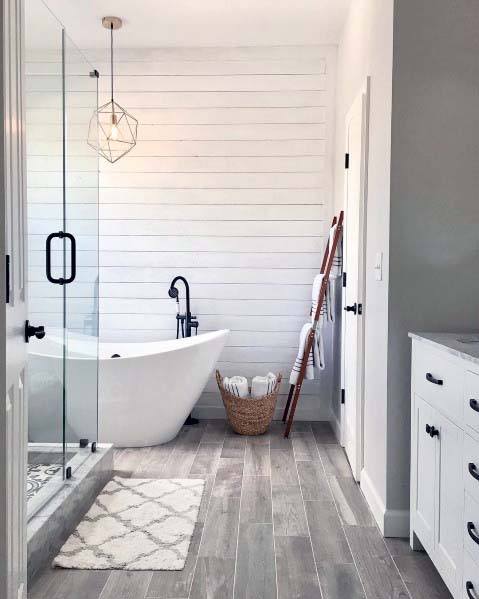 white shiplap wall in modern bathroom