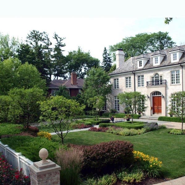 tree-lined front yard walk path