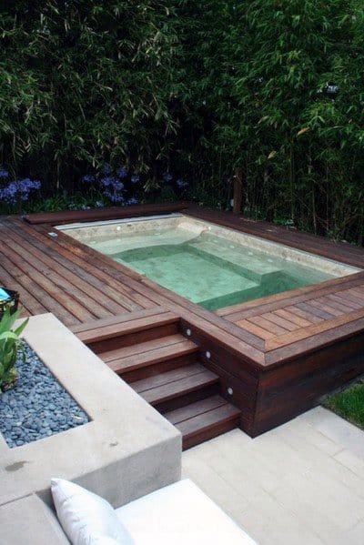small hot tub wood deck backyard