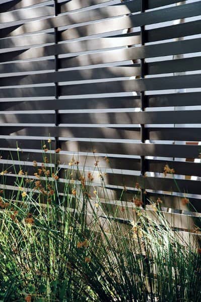 contemporary metal slat fence