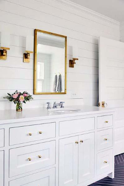 white shiplap wall bathroom with gold accents