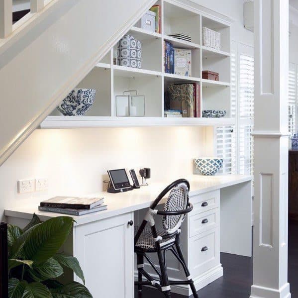 home interior under stairs desk with above storage