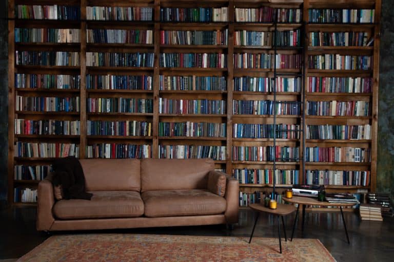 home library with tan couch