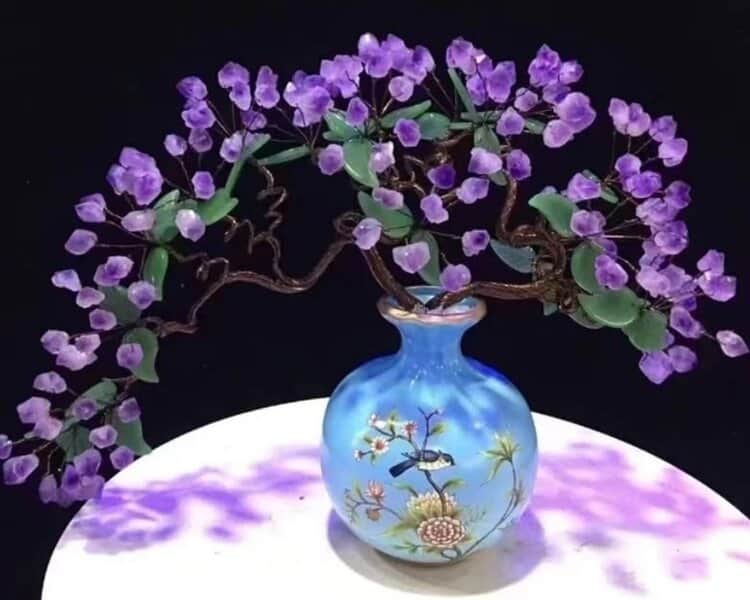 An Amethyst Wealth Plant in a decorative vase, known for bringing prosperity and positive energy, enhancing the space's decor.