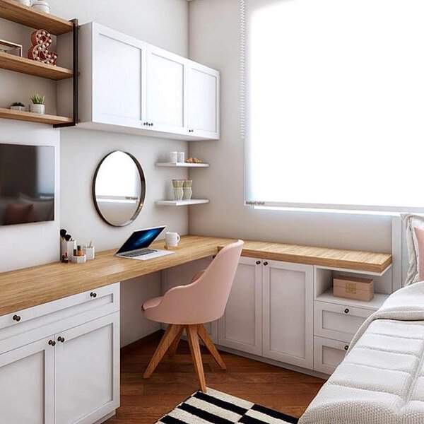 A round mirror above the desk reflects light and energy, enhancing positivity while avoiding negative reflections in this well-balanced workspace.