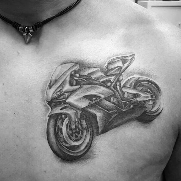 Realistic Honda sportbike tattoo on a man's chest, featuring detailed shading and a dynamic motion effect.