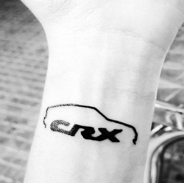 Minimalist Honda CRX tattoo on a man's wrist, featuring a simple black outline of the car with bold lettering for a sleek design.