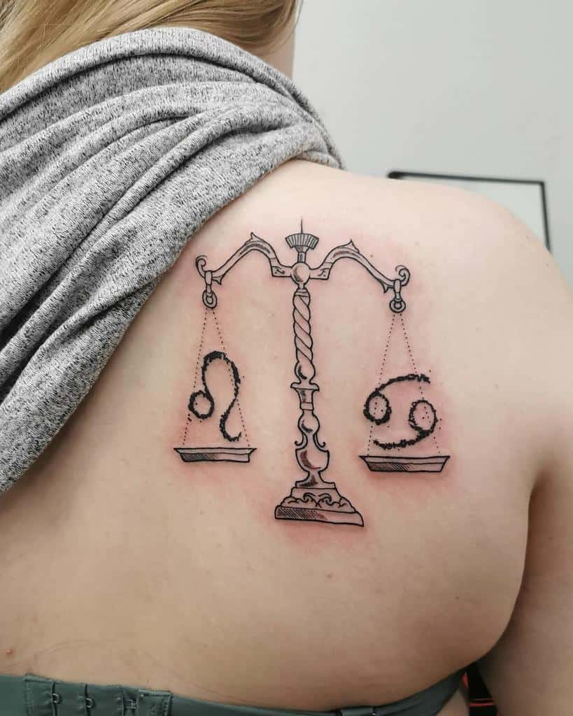 Zodiac-themed tattoo with a beautifully shaded balance scale, featuring Leo and Cancer symbols for cosmic equilibrium.