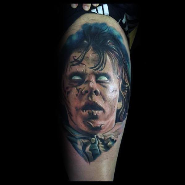 Realistic color tattoo of Regan from *The Exorcist*, featuring her possessed face, eerie white eyes, and detailed shading for a terrifying horror effect.